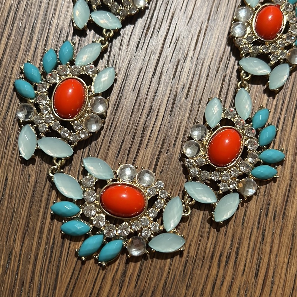 Statement necklace. Gold tone w/turquoise, coral colors. Adjustable 18-20”